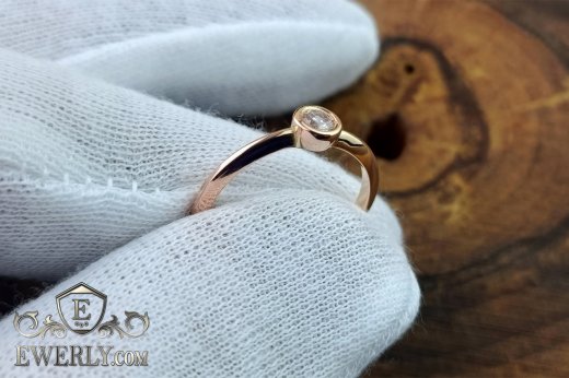 Buy a women's gold ring with a stone. 14k gold with fianite